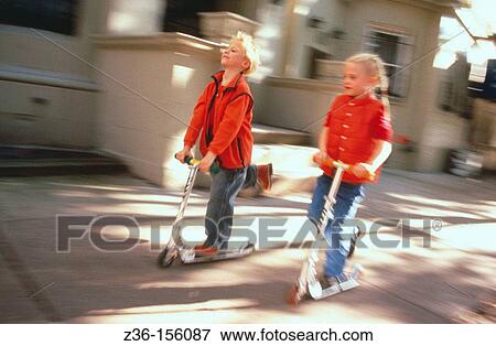 Stock Photo - Children with scooters. Fotosearch