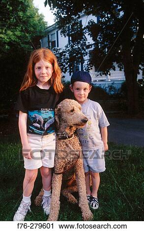 Children with standard poodle View Large Photo Image Stock Image - Children with standard poodle. Fotosearch