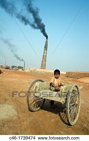 Children working on a brick factory near Kolkata, India, Ganges River. View Large Photo Image Picture - Children working on a brick factory near Kolkata, India, Ganges River.. Fotosearch
