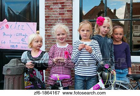 Childrens birthday party with young girls aged 4 to 7 in quiet small town of Edam Holland outside of Amsterdam with great small peaceful feel View Large Photo Image Stock Photo - Childrens birthday party with young girls aged 4 to 7 in quiet small town of Edam Holland outside of Amsterdam with great small peaceful feel. Fotosearch