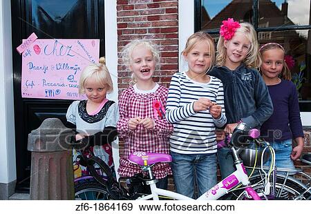 Childrens birthday party with young girls aged 4 to 7 in quiet small town of Edam Holland outside of Amsterdam with great small peaceful feel View Large Photo Image Stock Photo - Childrens birthday party with young girls aged 4 to 7 in quiet small town of Edam Holland outside of Amsterdam with great small peaceful feel. Fotosearch