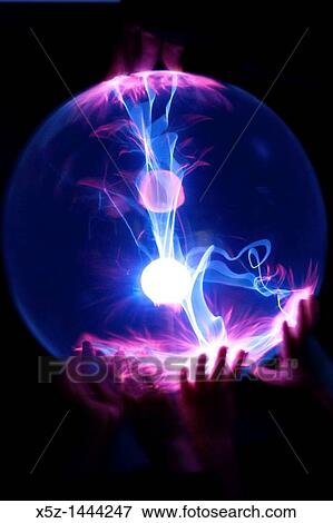 Stock Photo - Children's hands on a Plasma Globe. Fotosearch