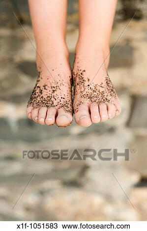 child's feet covered in sand View Large Photo Image Stock Image - child's feet covered in sand. Fotosearch