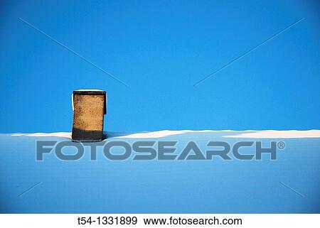 Chimney on a snow-covered roof View Large Photo Image Stock Photo - Chimney on a snow-covered roof. Fotosearch