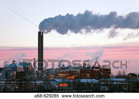 Stock Photography - Chimney on district heating plant in Uppsala. Sweden. Winter morning. Fotosearch