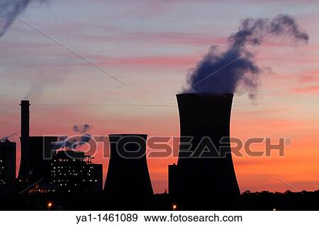 Chimneys and buildings silhouettes during sunrise on coal electrical power station Emile Huchet, Carling Saint Avold, Moselle, France View Large Photo Image Stock Photo - Chimneys and buildings silhouettes during sunrise on coal electrical power station Emile Huchet, Carling Saint Avold, Moselle, France. Fotosearch