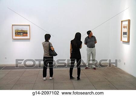 Stock Image - China, Beijing, Chaoyang District, 798 Art Zone, Dashanzi Art District, former Factory 798, gentrification, BoBo Community, Asian, man, woman, looking, watercolor, gallery,.. Fotosearch
