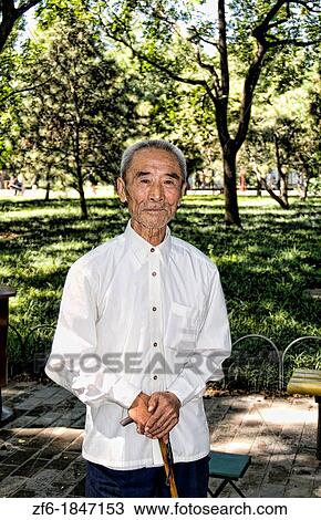 China Beijing Local old man in park with old traditional costume in Beijing China View Large Photo Image Stock Image - China Beijing Local old man in park with old traditional costume in Beijing China. Fotosearch