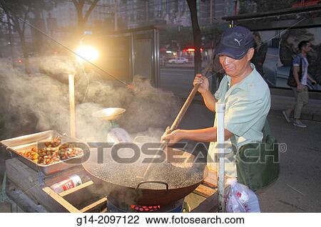 China, Beijing, Xicheng District, Guang An Men Nei Da Jie, Guanganmen Outer Street, Asian, man, street vendor, cooking, roasting, chestnuts, nuts, sale, night,. View Large Photo Image Stock Image - China, Beijing, Xicheng District, Guang An Men Nei Da Jie, Guanganmen Outer Street, Asian, man, street vendor, cooking, roasting, chestnuts, nuts, sale, night,.. Fotosearch