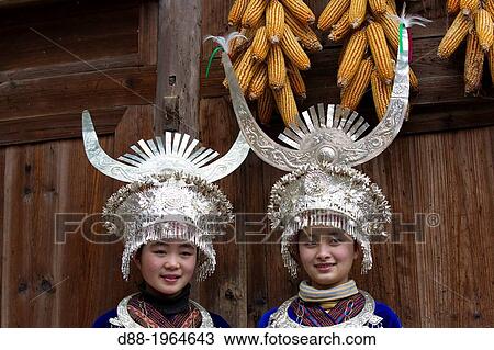 Stock Image - China, Guizhou province, Langde village, Long Skirt Miao people in traditional dress.. Fotosearch