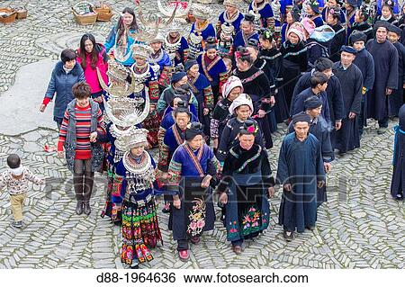 China, Guizhou province, Langde village, Long Skirt Miao people in traditional dress, mens are playing lusheng,. View Large Photo Image Stock Photograph - China, Guizhou province, Langde village, Long Skirt Miao people in traditional dress, mens are playing lusheng,.. Fotosearch