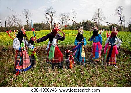 Stock Photograph - China, Guizhou province, Zhouguan village, DiXi, or Ground Opera, the living fossil of the Opera, in the fields.. Fotosearch