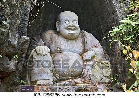 Stock Photograph - China, Hangzhou, temple of solitude: Stone Buddha. Fotosearch