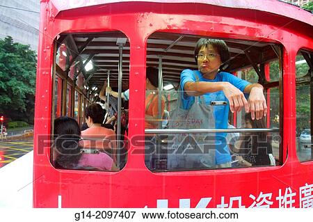 China, Hong Kong, Island, Causeway Bay, Causeway Road, Cantonese Chinese characters h? nz? pinyin, double decker tram Tramways, public transportation, Asian, man, rider, passenger,. View Large Photo Image Stock Photo - China, Hong Kong, Island, Causeway Bay, Causeway Road, Cantonese Chinese characters h? nz? pinyin, double decker tram Tramways, public transportation, Asian, man, rider, passenger,.. Fotosearch