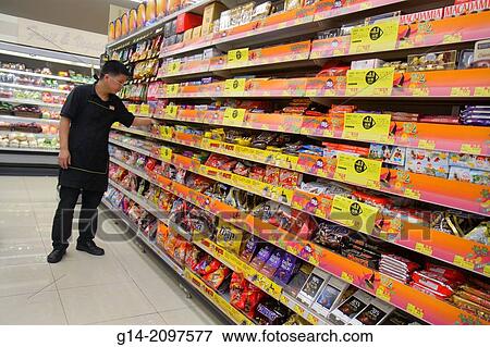 China, Hong Kong, North Point, Java Road, Wellcome Supermarket, grocery store, food, sale, display, shopping, candy, shelves, Asian, man, employee, working, stock clerk,. View Large Photo Image Stock Photo - China, Hong Kong, North Point, Java Road, Wellcome Supermarket, grocery store, food, sale, display, shopping, candy, shelves, Asian, man, employee, working, stock clerk,.. Fotosearch