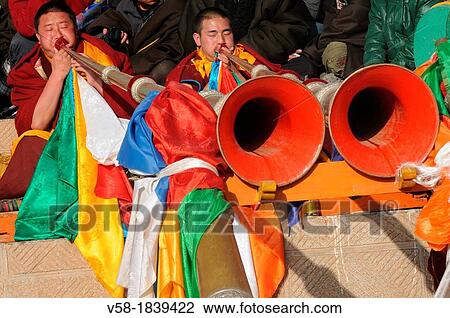 China, Qinghai, Amdo, Tongren Rebkong, Lower Wutun monastery, Losar New Year festival, Cham dances, Monks blowing telescoping trumpets View Large Photo Image Stock Image - China, Qinghai, Amdo, Tongren Rebkong, Lower Wutun monastery, Losar New Year festival, Cham dances, Monks blowing telescoping trumpets. Fotosearch