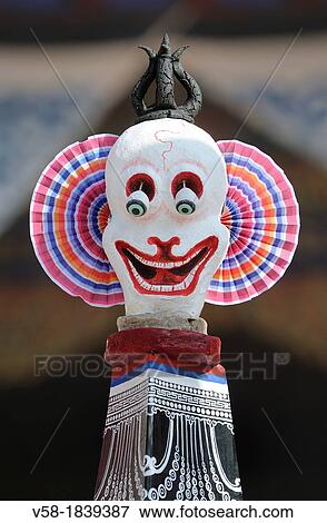 China, Qinghai, Amdo, Tongren Rebkong, Lower Wutun monastery, Losar New Year festival, Cheerful skull sitting on top of a giant torma offering cake symbolising evil forces View Large Photo Image Stock Photo - China, Qinghai, Amdo, Tongren Rebkong, Lower Wutun monastery, Losar New Year festival, Cheerful skull sitting on top of a giant torma offering cake symbolising evil forces. Fotosearch