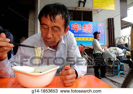 China, Shanghai, Huangpu District, Renmin Road, Yuyuan Garden, Asian, man, eating, chopsticks, noodles, soup, cafe, restaurant, Mandarin symbols, hanzi, View Large Photo Image Stock Image - China, Shanghai, Huangpu District, Renmin Road, Yuyuan Garden, Asian, man, eating, chopsticks, noodles, soup, cafe, restaurant, Mandarin symbols, hanzi,. Fotosearch