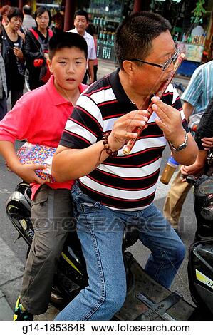 China, Shanghai, Huangpu District, Yuyuan Garden, Fuyou Road, shopping, market, marketplace, Asian, man, father, flute, playing, electric motor scooter, boy, son, rider, View Large Photo Image Stock Photo - China, Shanghai, Huangpu District, Yuyuan Garden, Fuyou Road, shopping, market, marketplace, Asian, man, father, flute, playing, electric motor scooter, boy, son, rider,. Fotosearch