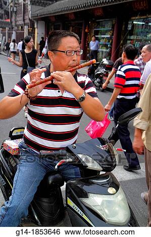 China, Shanghai, Huangpu District, Yuyuan Garden, Fuyou Road, shopping, market, marketplace, Asian, man, flute, playing, electric motor scooter, View Large Photo Image Stock Photograph - China, Shanghai, Huangpu District, Yuyuan Garden, Fuyou Road, shopping, market, marketplace, Asian, man, flute, playing, electric motor scooter,. Fotosearch