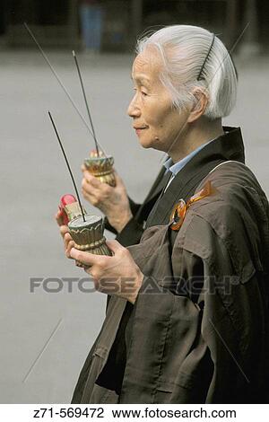 China, Shanghai, Longhua Buddhist Temple, ceremony, old lady View Large Photo Image Stock Image - China, Shanghai, Longhua Buddhist Temple, ceremony, old lady. Fotosearch