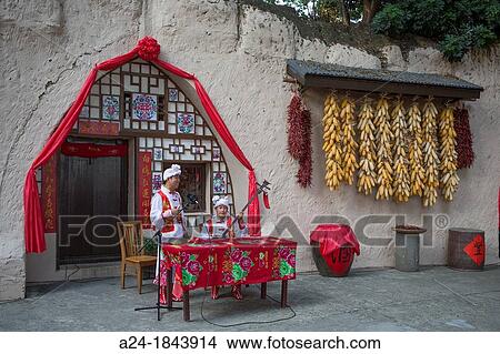 China, Shenzhen City, Splendid China Park, cave dwelling, playing music, corn View Large Photo Image Picture - China, Shenzhen City, Splendid China Park, cave dwelling, playing music, corn. Fotosearch