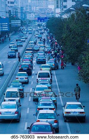 China. Yunnan Province. Kunming: Rush Hour Traffic along Chuncheng Lu / Dusk View Large Photo Image Stock Image - China. Yunnan Province. Kunming: Rush Hour Traffic along Chuncheng Lu / Dusk. Fotosearch