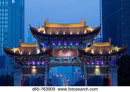 China. Yunnan Province. Kunming: Memorial Arch of the Golden Horse and Jade Rooster in Jinmabiji Square / Evening View Large Photo Image Stock Photo - China. Yunnan Province. Kunming: Memorial Arch of the Golden Horse and Jade Rooster in Jinmabiji Square / Evening. Fotosearch