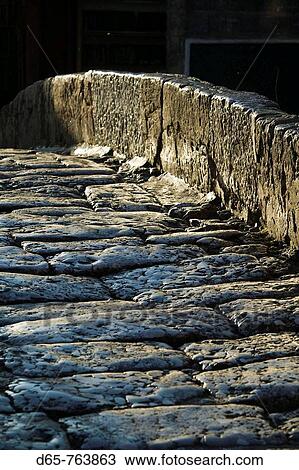 Stock Image - China, Yunnan Province, Lijiang, Old Town, pedestrian zone paving stone detail. Fotosearch