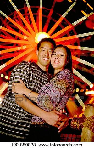 Chinese American couple at amusement park MR View Large Photo Image Stock Photo - Chinese American couple at amusement park MR. Fotosearch