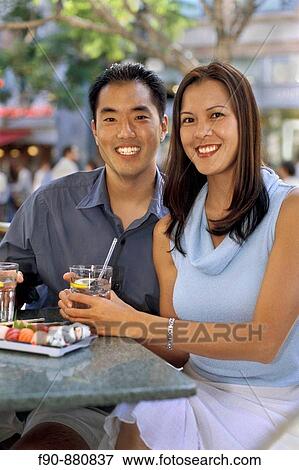 Chinese American couple lunch at outdoor cafe MR View Large Photo Image Stock Photo - Chinese American couple lunch at outdoor cafe MR. Fotosearch