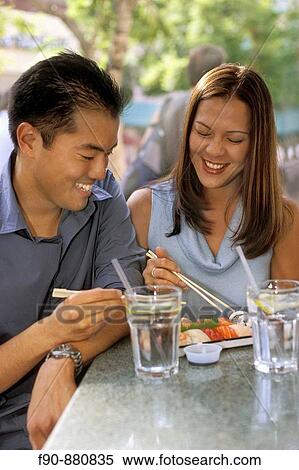 Chinese American couple lunch at outdoor cafe MR View Large Photo Image Stock Photography - Chinese American couple lunch at outdoor cafe MR. Fotosearch