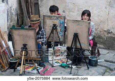 Picture - Chinese art students at work in Xidi heritage village in Huizhou region, Anhui.. Fotosearch