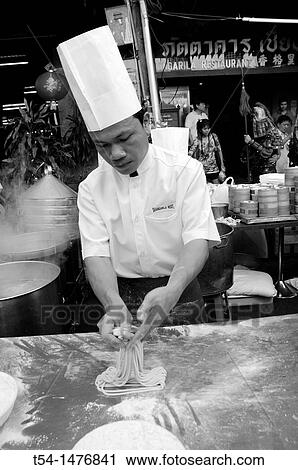 Chinese Coock makes fresh Noodels View Large Photo Image Stock Image - Chinese Coock makes fresh Noodels. Fotosearch