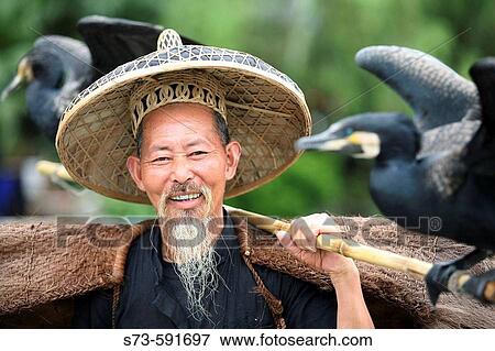 Stock Photo - Chinese cormorant fisherman. Yangshuo. China.. Fotosearch