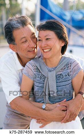 Chinese couple hugging View Large Photo Image Stock Photo - Chinese couple hugging. Fotosearch