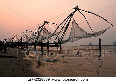 Chinese fishing nets at dusk, Fort Cochin, Kerala, South India. View Large Photo Image Stock Photo - Chinese fishing nets at dusk, Fort Cochin, Kerala, South India.. Fotosearch