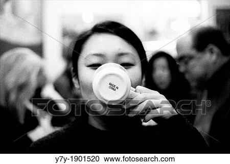 Chinese girl drinking from a mug marked? Made in China? View Large Photo Image Stock Image - Chinese girl drinking from a mug marked? Made in China?. Fotosearch