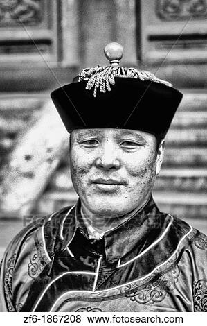 Stock Photo - Chinese man and traditional dress at Summer Palace in Beijing China. Fotosearch