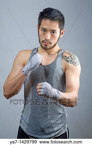 Stock Photo - Chinese Man with Tattoo. Fotosearch