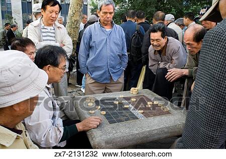 Chinese men playing mahjong aka mah jongg Columbus Park Chinatown New York City lower east side View Large Photo Image Stock Image - Chinese men playing mahjong aka mah jongg Columbus Park Chinatown New York City lower east side. Fotosearch