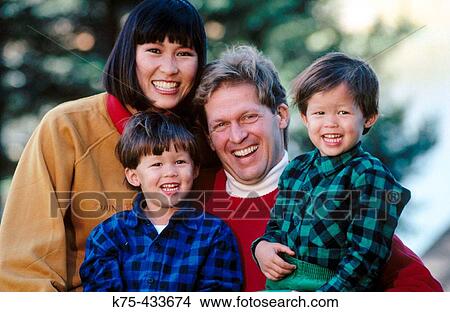 Chinese mom and Caucasian dad with their twin sons View Large Photo Image Picture - Chinese mom and Caucasian dad with their twin sons. Fotosearch
