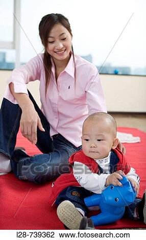 chinese mother and with baby at home View Large Photo Image Stock Image - chinese mother and with baby at home. Fotosearch