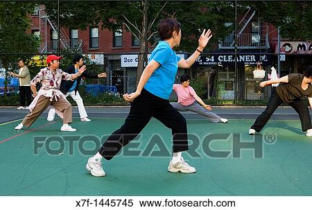 Chinese people performing early morning Tai Chi exercises, New York City, USA View Large Photo Image Stock Photography - Chinese people performing early morning Tai Chi exercises, New York City, USA. Fotosearch