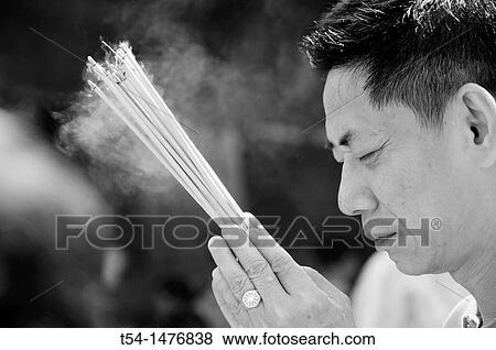 Chinese People Praying with Incense Sticks View Large Photo Image Stock Photo - Chinese People Praying with Incense Sticks. Fotosearch