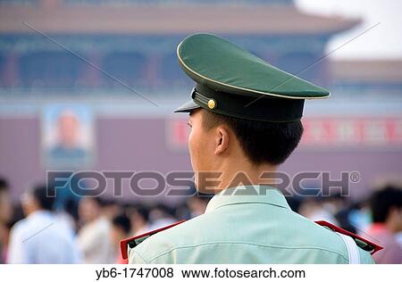 Stock Photo - Chinese Policeman in the Tienanmen Square at the entrance of the Forbidden City, Beijing, China.. Fotosearch