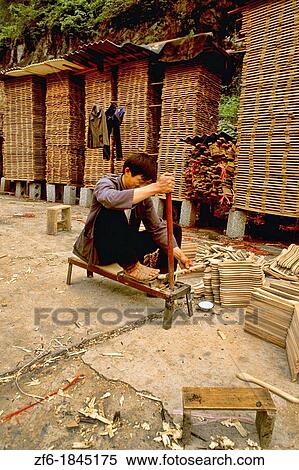 Chinese worker manufacturing hangers in Yangshou China. View Large Photo Image Stock Photography - Chinese worker manufacturing hangers in Yangshou China.. Fotosearch