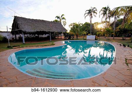 Stock Image - Chiquitos hotel, swimming pool. Concepci? n, town in the lowlands of Eastern Bolivia. It is known as part of the Jesuit Missions of the Chiquitos, declared in 1990 a World Heritage Site, as a former Jesuit Reduction. Bolivia.. Fotosearch