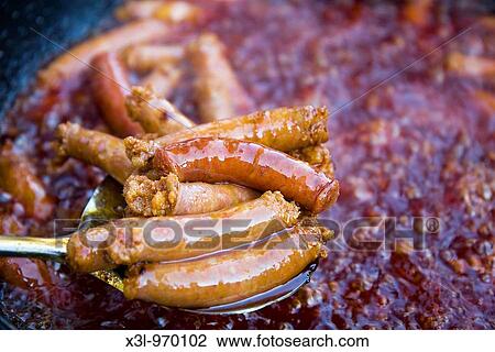 Stock Image - Chistorra, a type of sausage made in Navarre Spain. Fotosearch