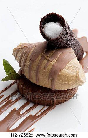 Chocolate cake with coffee ice cream and filled cocoa biscuit at restaurant Yayo Daporta, Cambados. Pontevedra province, Galicia, Spain View Large Photo Image Stock Photography - Chocolate cake with coffee ice cream and filled cocoa biscuit at restaurant Yayo Daporta, Cambados. Pontevedra province, Galicia, Spain. Fotosearch